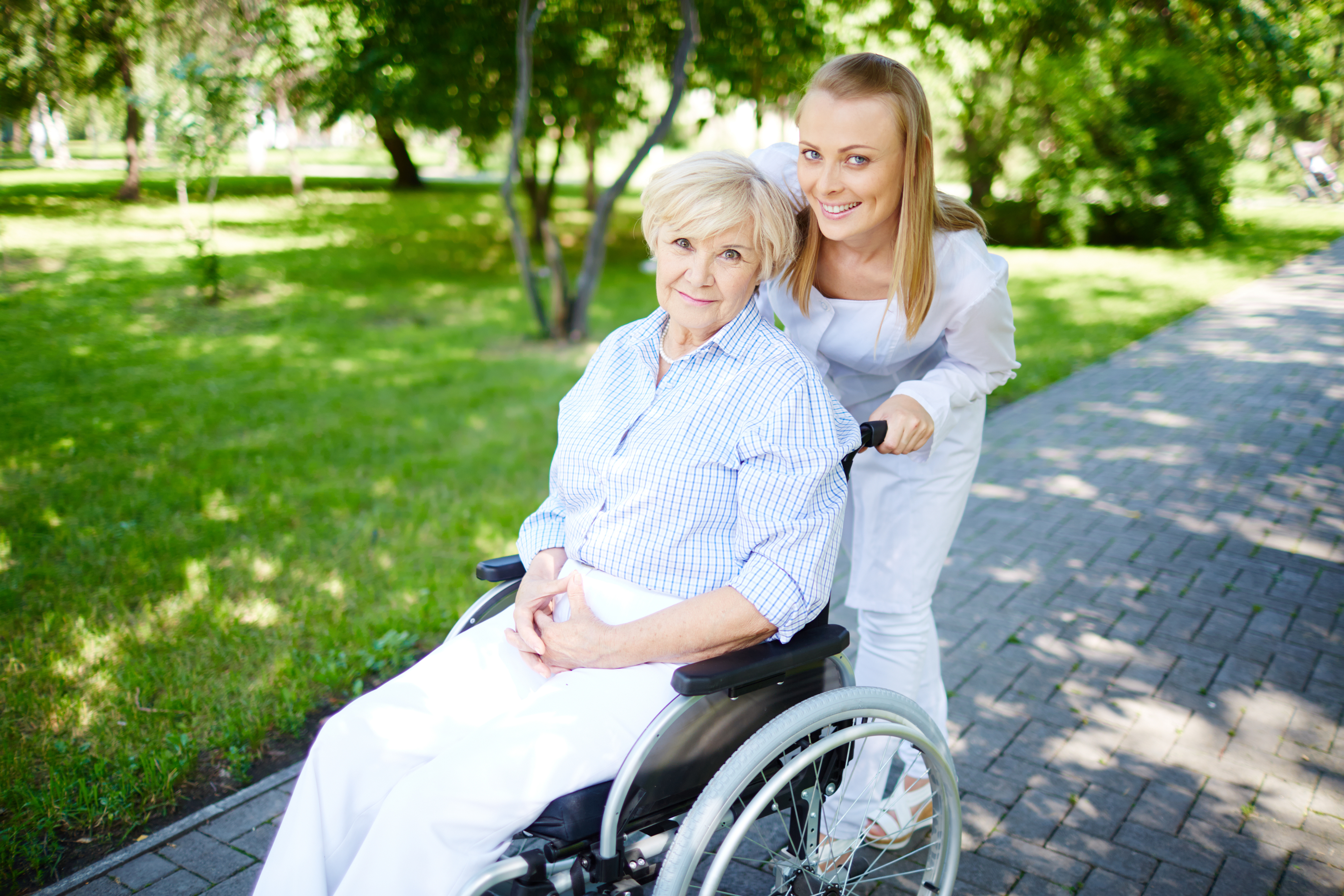 Elderly woman with a caregiver